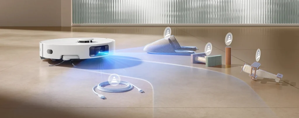 El robot aspirador Dreame D20 Pro Plus utilizando su sistema de navegación con luz estructurada 3D para detectar y esquivar con precisión obstáculos cotidianos como cables, zapatillas y juguetes, demostrando su tecnología de limpieza inteligente.