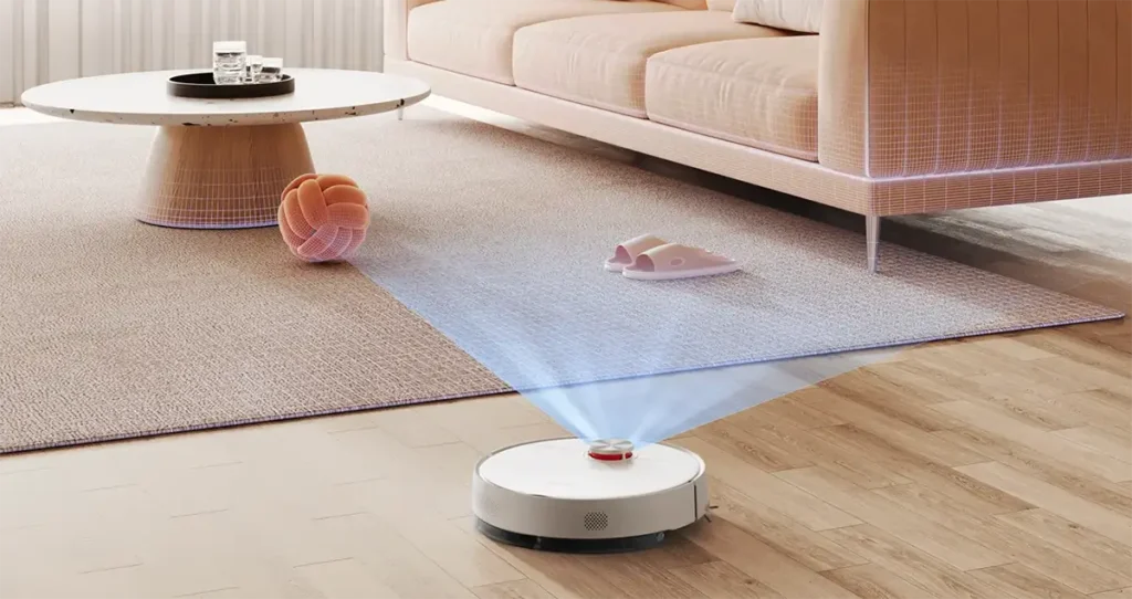 Robot aspirador Xiaomi S40 en un salón, escaneando el suelo con su sistema de navegación láser LDS. Un haz de luz azul muestra cómo mapea la habitación y detecta objetos