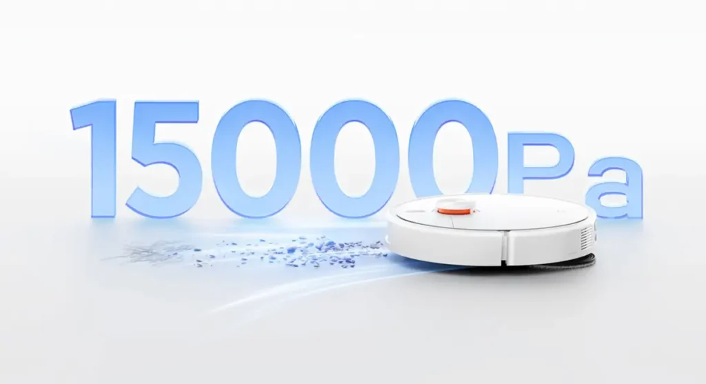 Imagen promocional del robot aspirador Xiaomi Mijia 5C demostrando su potente succión de 15.000 Pa, aspirando polvo y partículas de un suelo blanco.