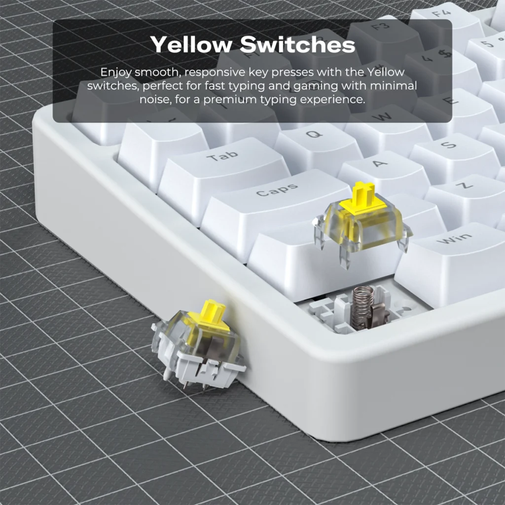 Primer plano de un teclado mecánico blanco MK1 con interruptores amarillos (Yellow Switches). Se muestra un switch extraído junto a su socket para detallar el mecanismo, diseñado para una pulsación suave y silenciosa, ideal para gaming y escritura.