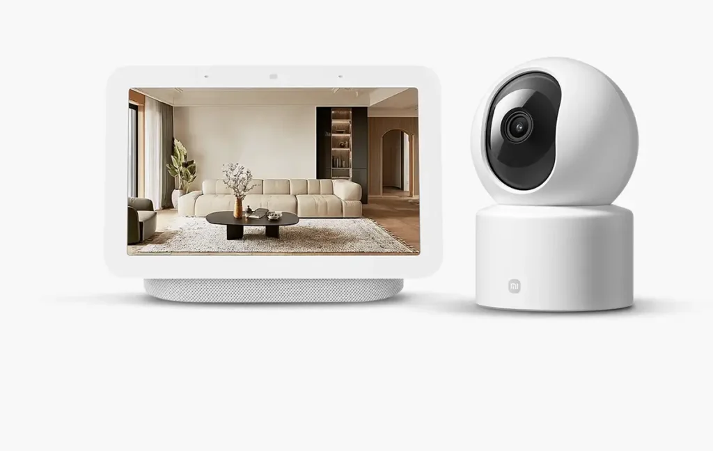 Integración de la Xiaomi Smart Camera C201 con el ecosistema de hogar inteligente, mostrando la transmisión de vídeo en directo en una pantalla inteligente compatible con Google Assistant o Alexa.