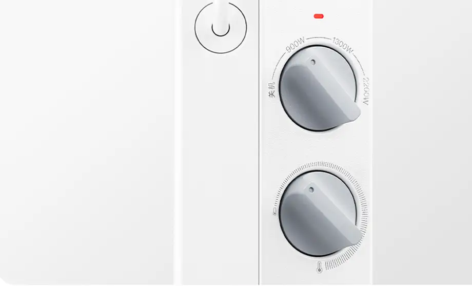 Controles manuales del calefactor Xiaomi Mijia Electric Heater 2. Se aprecian las dos ruletas: el selector de potencia con tres niveles (900W, 1300W, 2200W) y el termostato para regular la temperatura de la habitación.