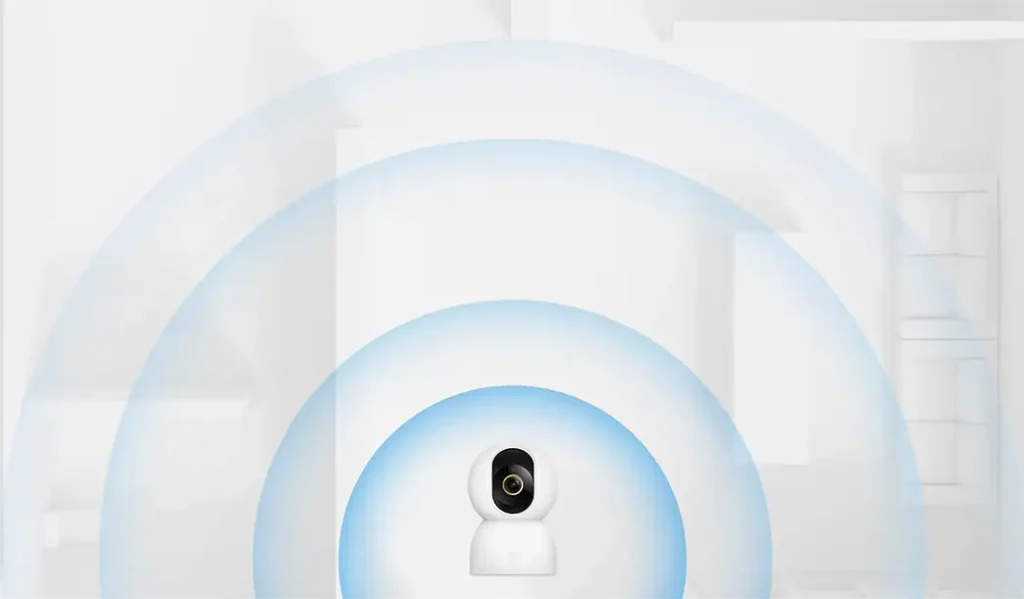 Ilustración de la cámara Xiaomi Smart Camera C701 emitiendo ondas azules que simbolizan la conectividad Wi-Fi 6 de doble banda y la detección de ruido y movimiento por IA para la vigilancia del hogar.