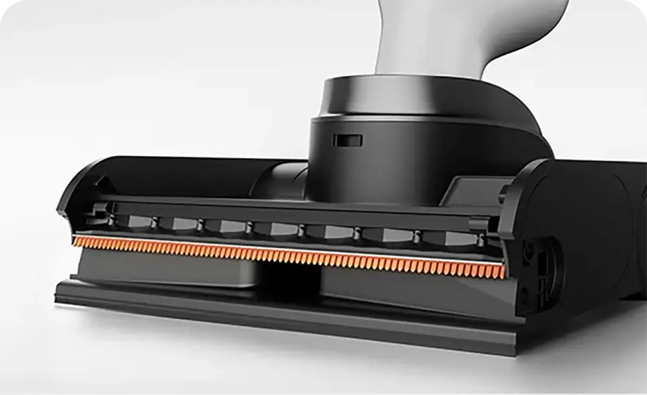 Detalle del cabezal de la Xiaomi Truclean W30 Pro con el peine antienredos de cuatro etapas y los dientes naranjas que evitan que el pelo se enrede en el rodillo.