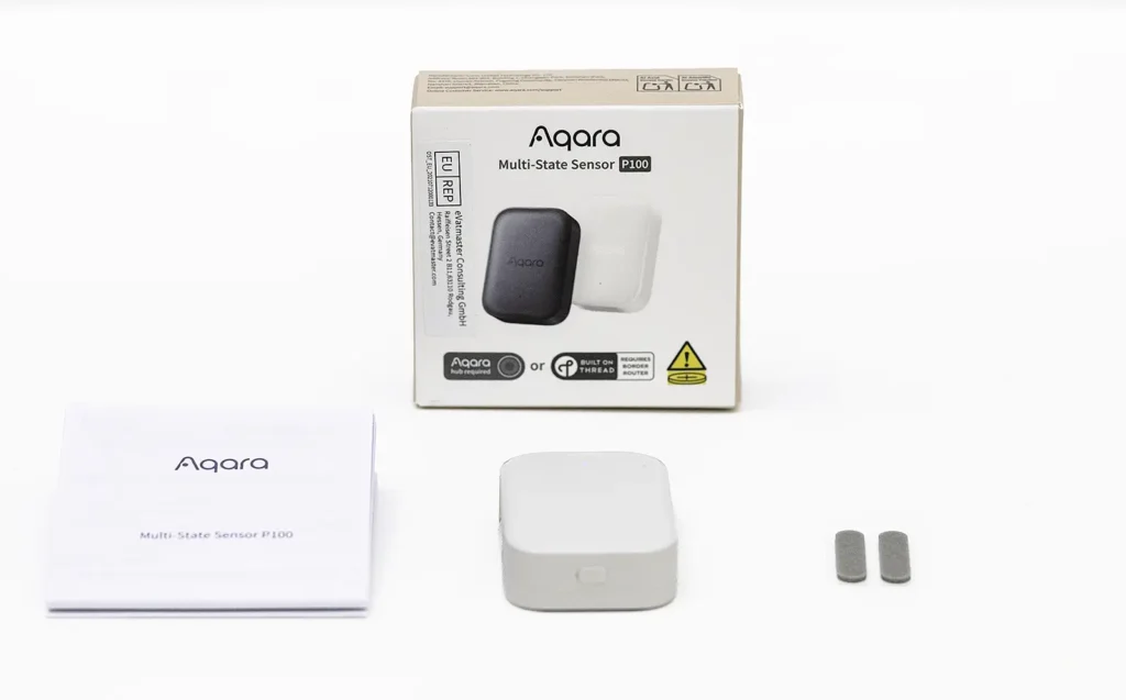 Contenido de la caja del Aqara Multi-State Sensor P100 con sensor, manual, adhesivos y embalaje